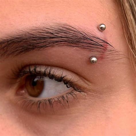 vertical eyebrow piercing